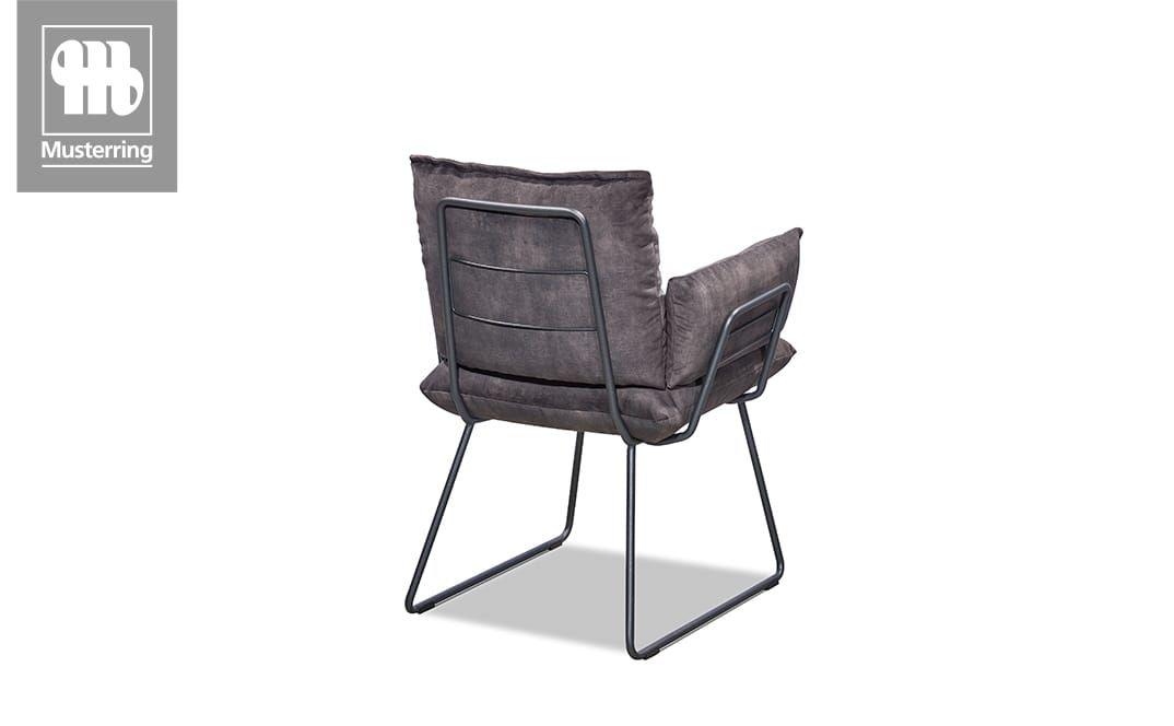 Dunkelgrauer Polsterstuhl mit Metallrahmen von hinten.